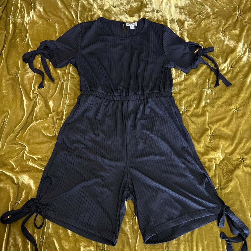Women’s unique21 Super cute romper. Black with vertical striping. Size 10